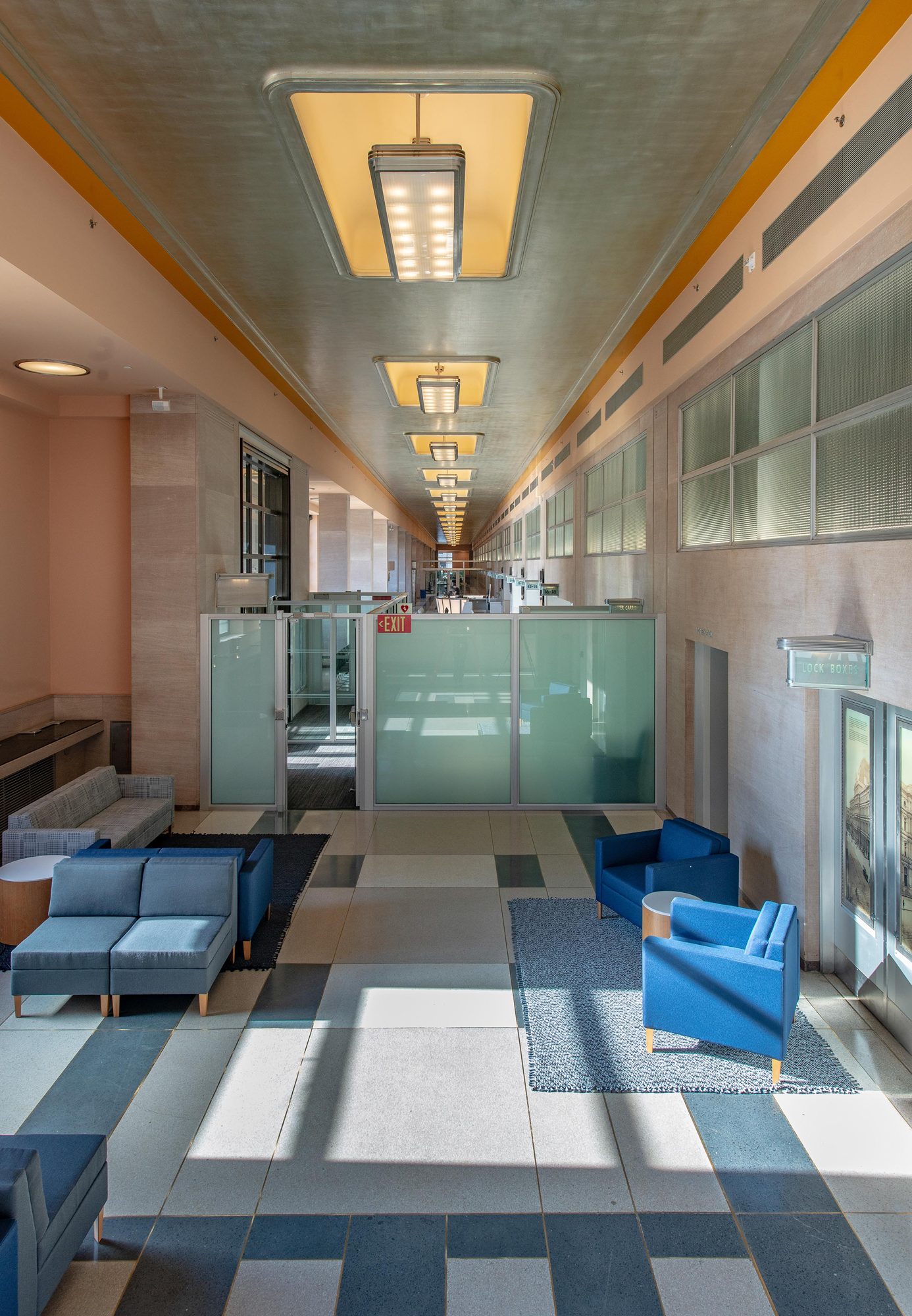 Public corridor with restored lighting and terrazzo floor