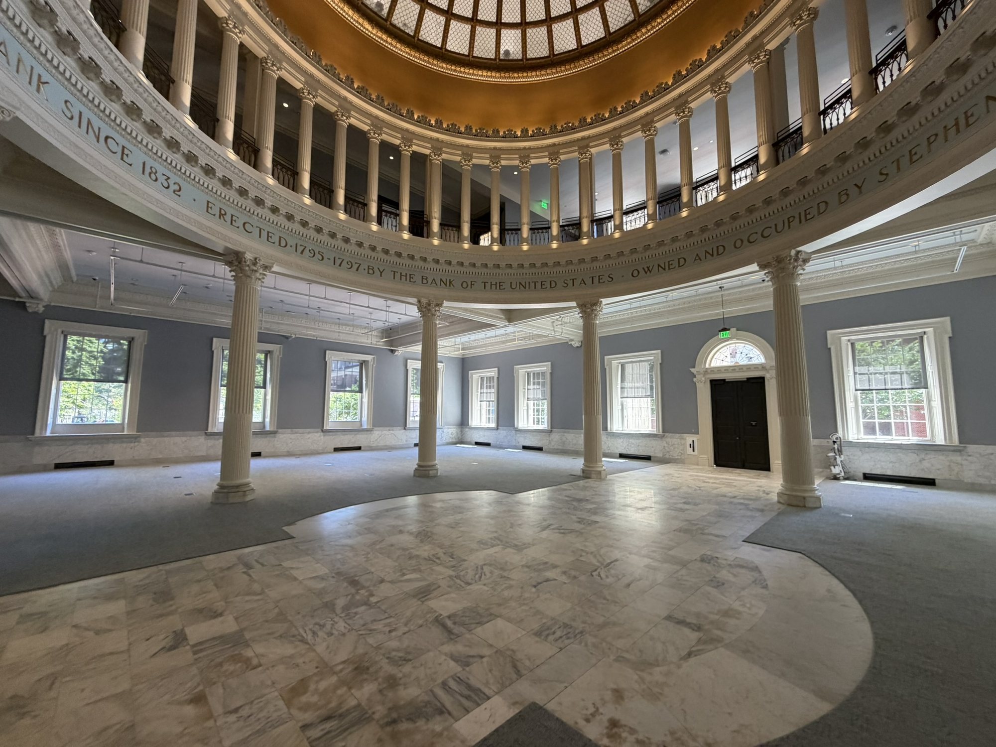 The restored First Bank rotunda with its gilded dome, colonnade and marble floor