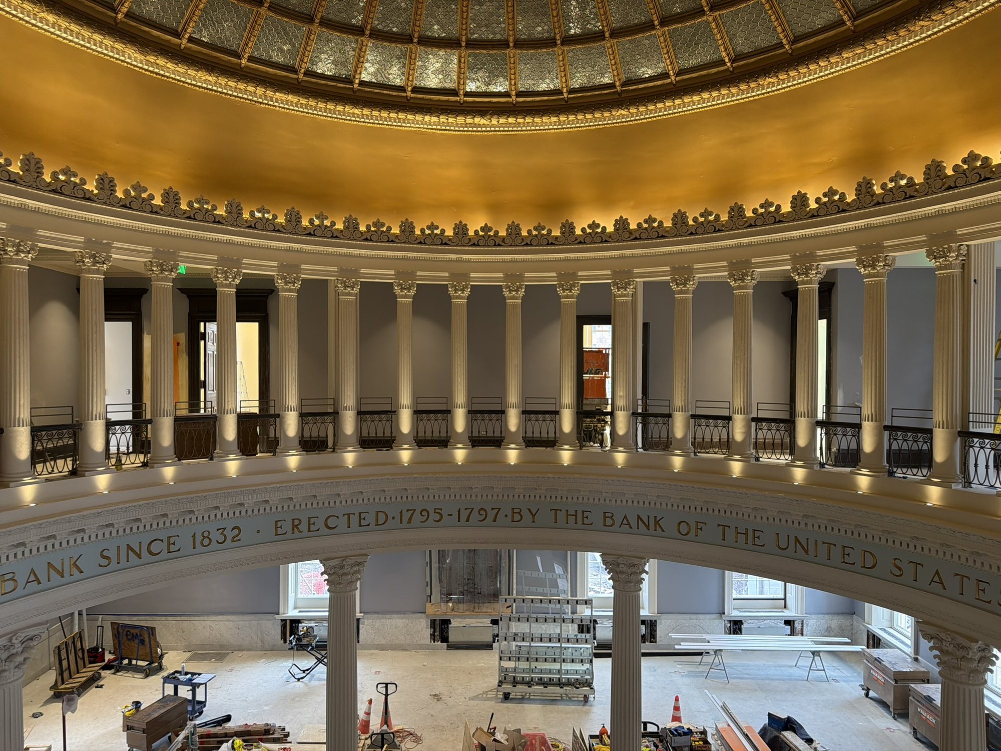 Rotunda colonnade and inscription while interior work continued below